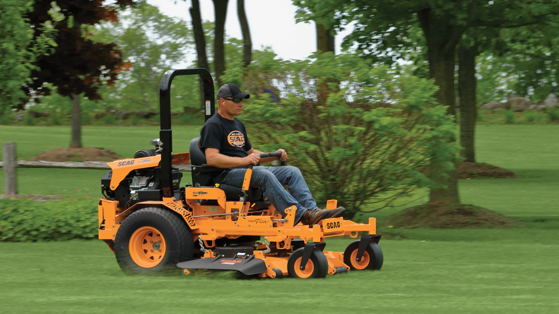 Image of Yellow Scag riding lawn tractor