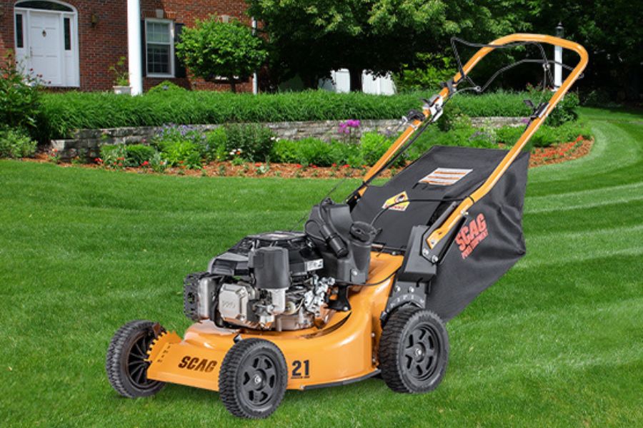 SFC-21 mower in a yard in front of a house