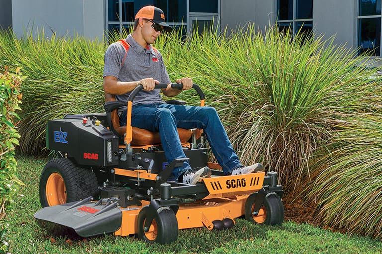 Man riding an EVZ mower